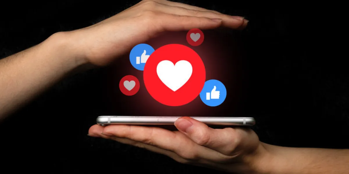 social media concept hands with smartphone and like notification icon social networking, black background photo social media concept hands with smartphone and like notification icon social networking, black background photo