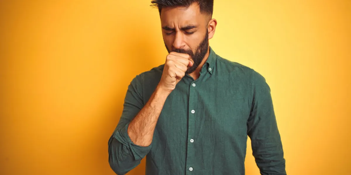 young indian businessman wearing elegant shirt standing over isolated white background feeling unwell and coughing as symptom for cold or bronchitis healthcare concept young indian businessman wearing elegant shirt standing over isolated white background feeling unwell and coughing as symptom for cold or bronchitis healthcare concept