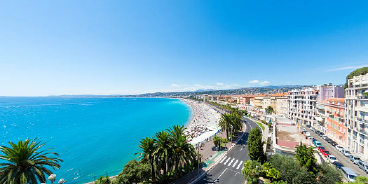 a view along the promenade des anglais and beach and seafront in nice, france logos removed