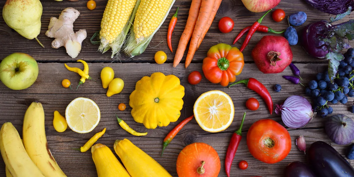 yellow, orange, red, purple fruits and vegetables on wooden background healthy food multicolored raw food copy space yellow, orange, red, purple fruits and vegetables on wooden background healthy food multicolored raw food copy space