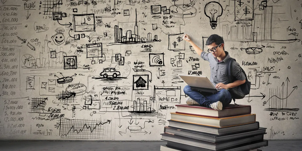 young businessman writing schemes