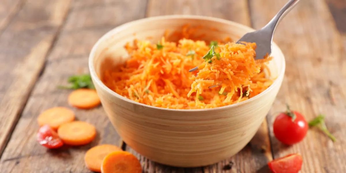 grated carrot- carrot salad and fork grated carrot- carrot salad and fork