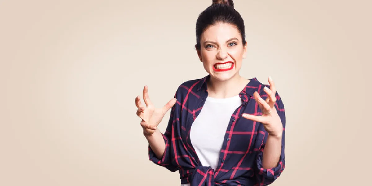 portrait of stressed and annoyed young casual styled caucasian woman with hair bun holding hands in mad furious gesture, screaming with ragea nd anger negative human emotions, facial expressions portrait of stressed and annoyed young casual styled caucasian woman with hair bun holding hands in mad furious gesture, screaming with ragea nd anger negative human emotions, facial expressions