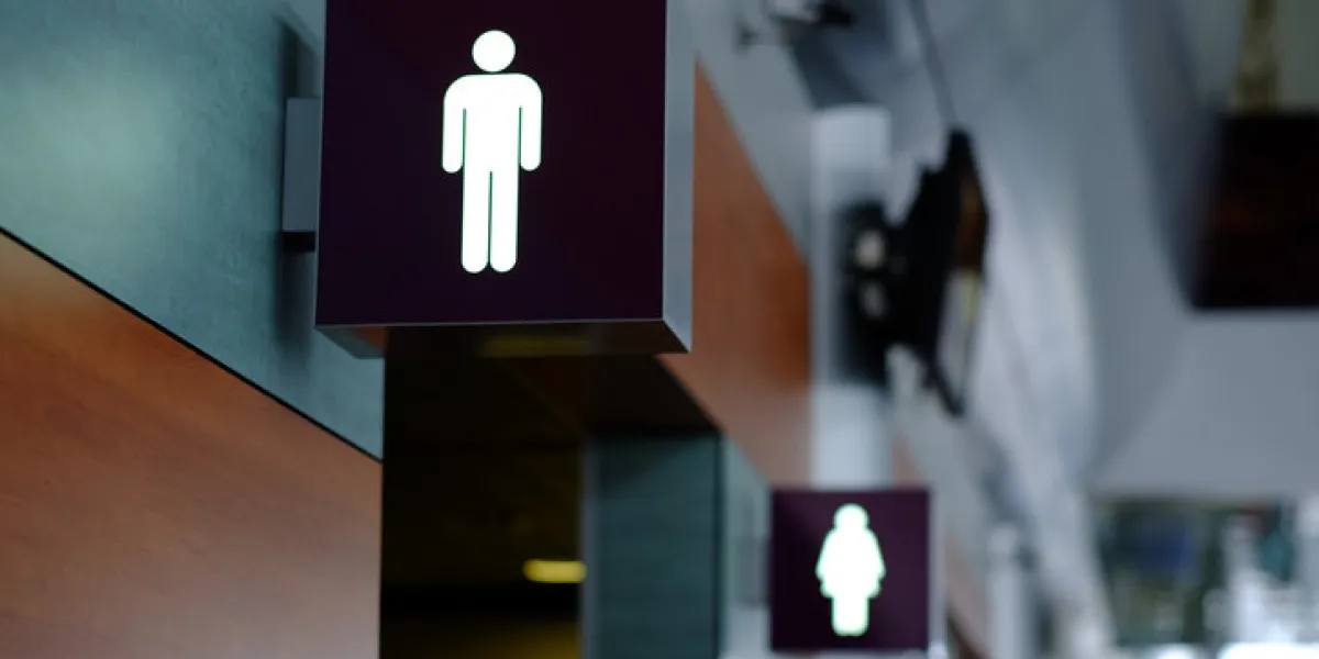 entrance to the male and female toilet sign in airport