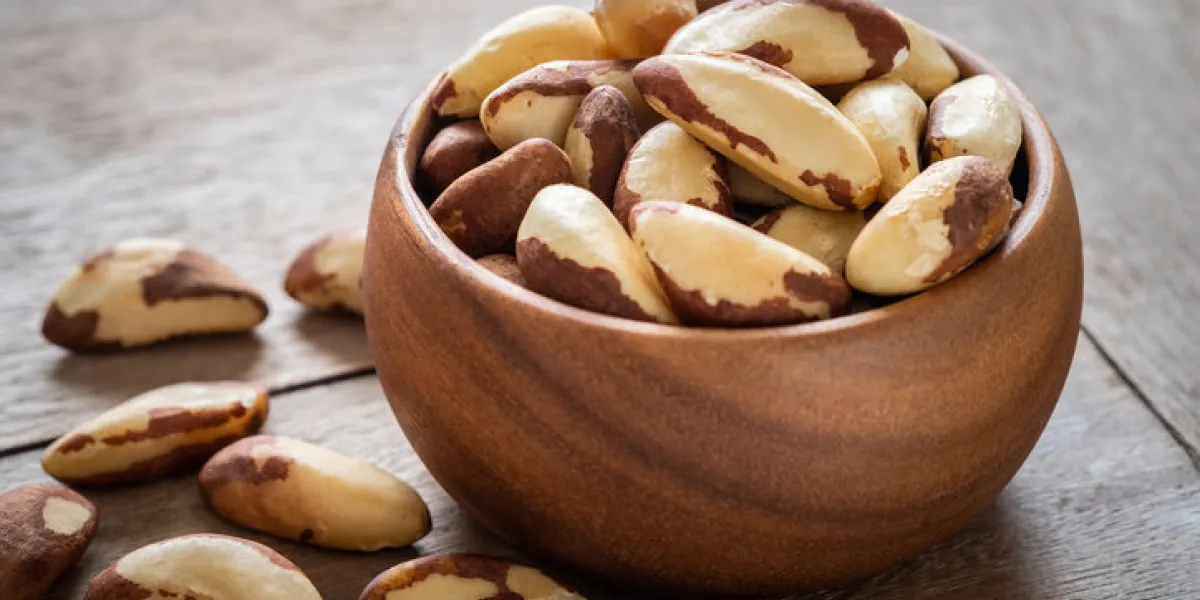 brazil nuts in wooden bowl brazil nuts in wooden bowl