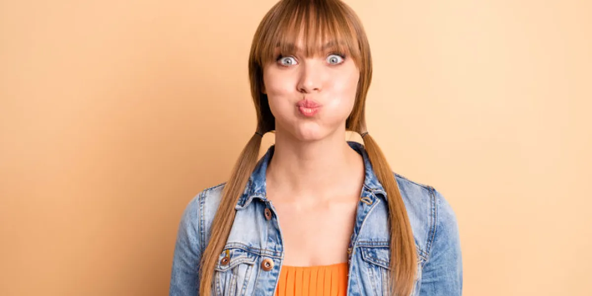 close up photo of lovely cute youth have free time satisfied content candid dressed modern, she her orange outfit isolated beige background