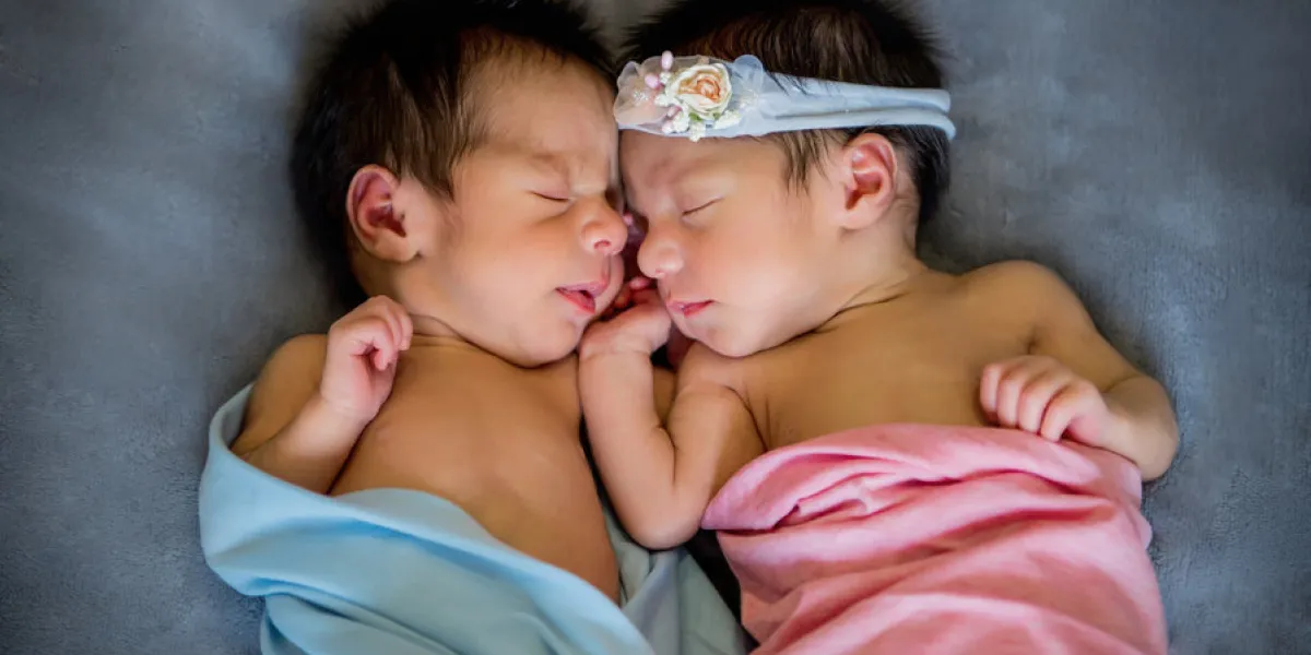 newborn twins boy and girl sleeping together newborn twins boy and girl sleeping together