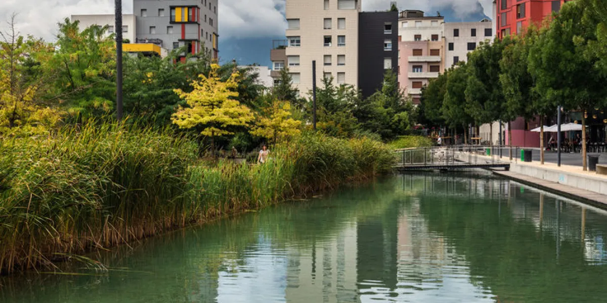 grenoble, france - august 18, 2018 water garden in sustainable complex, de bonne eco district eco-friendly living quarter with garden, boutiques and shops was built circling old military barracks