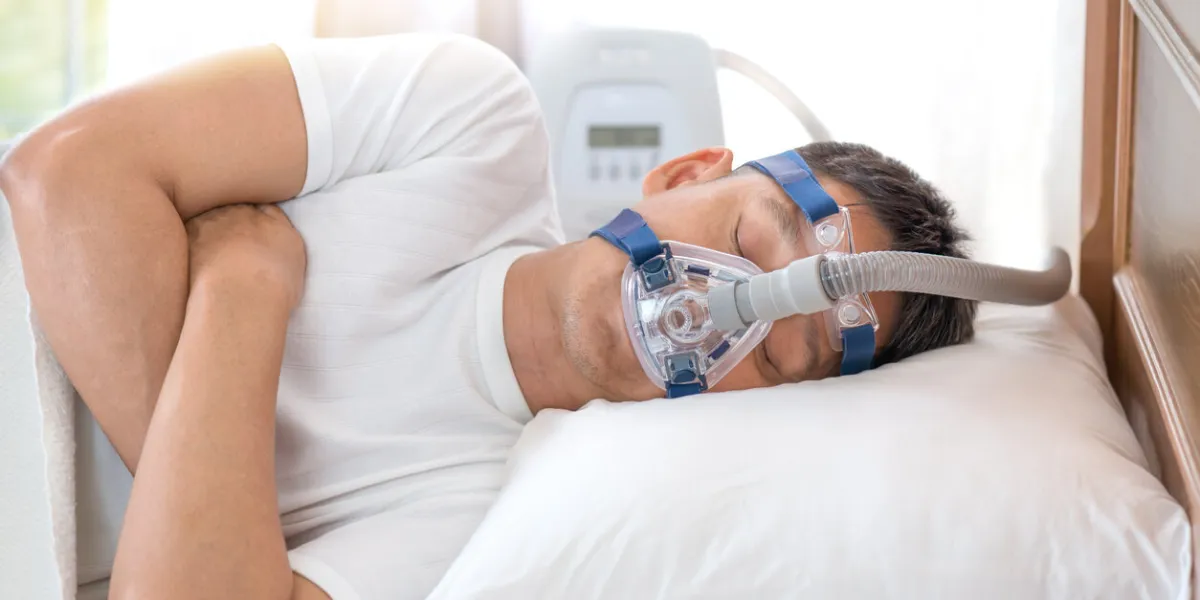 happy and healthy senior man sleeping deeply on his left side without snoring