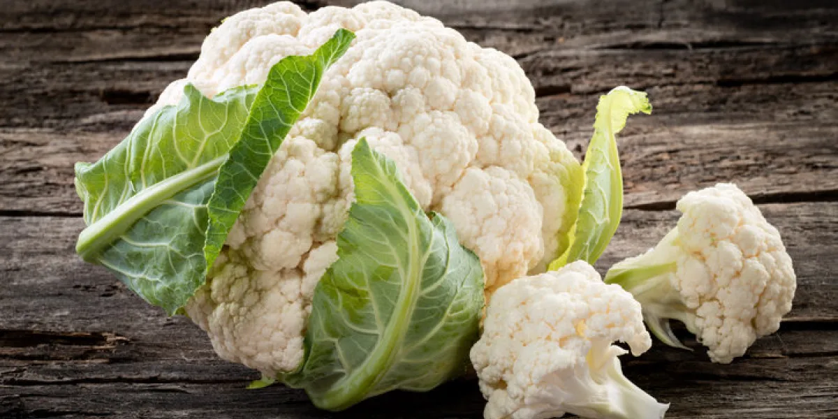 organic cauliflower on wooden background organic cauliflower on wooden background