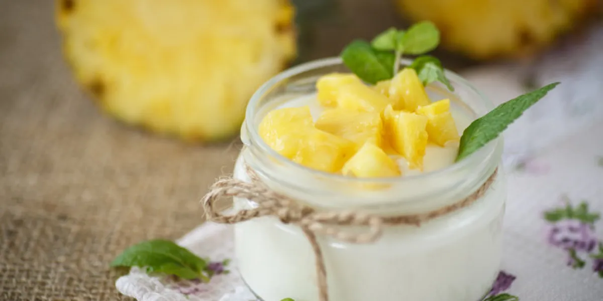 sweet homemade yogurt with pineapple in a glass jar sweet homemade yogurt with pineapple in a glass jar