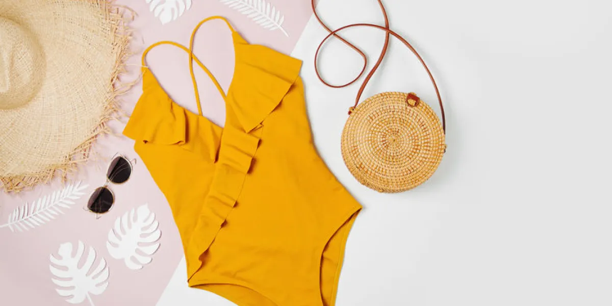 fashion bamboo bag and sunglass, straw hat and swimsuit flat lay, top view summer vacation concept fashion bamboo bag and sunglass, straw hat and swimsuit flat lay, top view summer vacation concept
