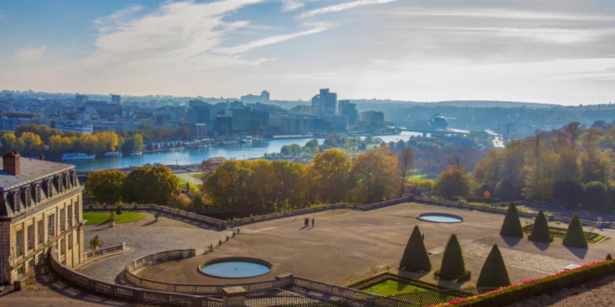 idyllic aerial view on paris   domaine national de saint-cloud and river seine at autumn topiary trees and golden autumn foliage in public park