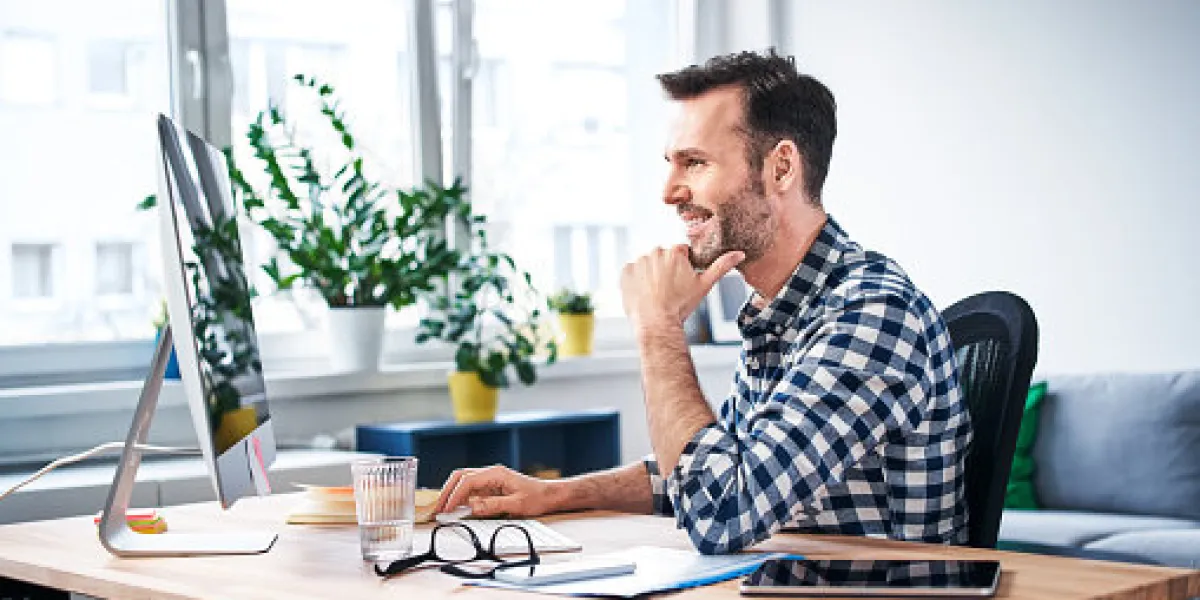 successful freelancer working on computer while staying at home