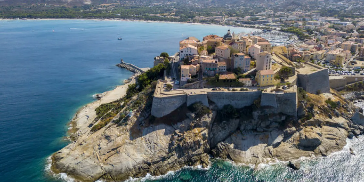 aerial view of calvi city, corsica, france walls of the city, cliff overlooking the sea