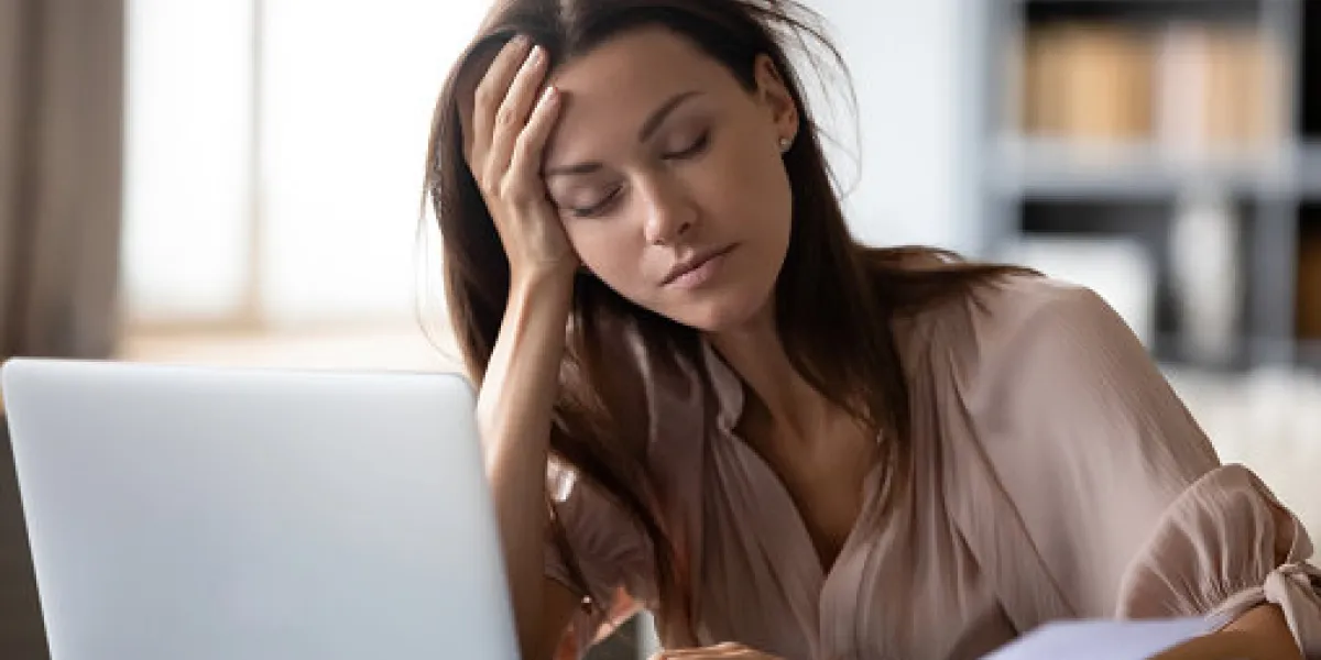 tired millennial girl student sit at desk fall asleep studying late hours at laptop at home, exhausted young woman take nap sleep at workplace working on computer, exhaustion, fatigue concept