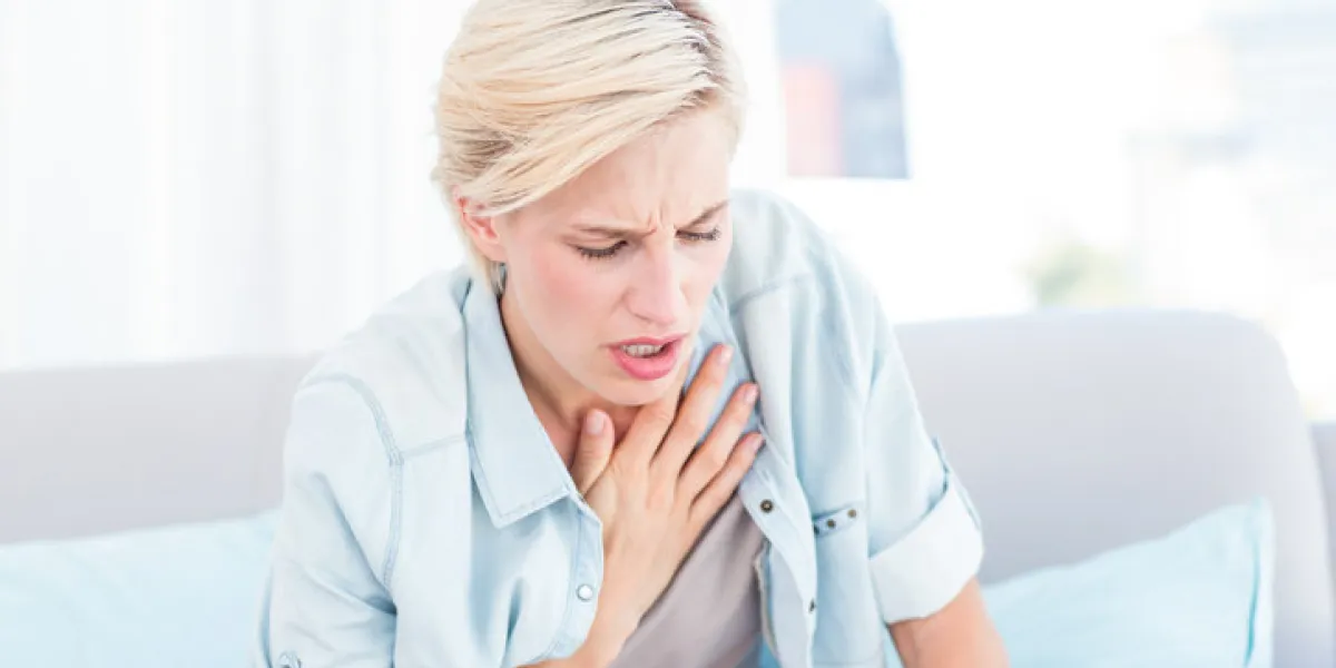 pretty blonde woman having breath difficulties in the living room pretty blonde woman having breath difficulties in the living room