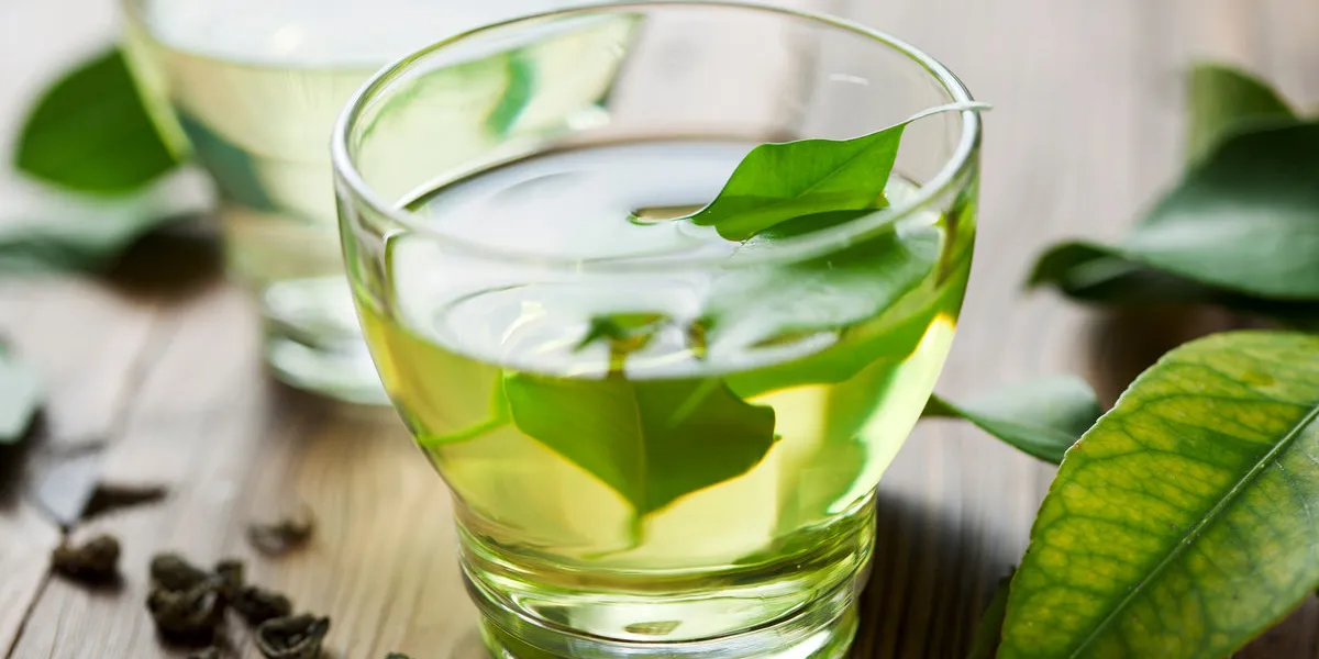 glass cup with fresh green tea glass cup with fresh green tea