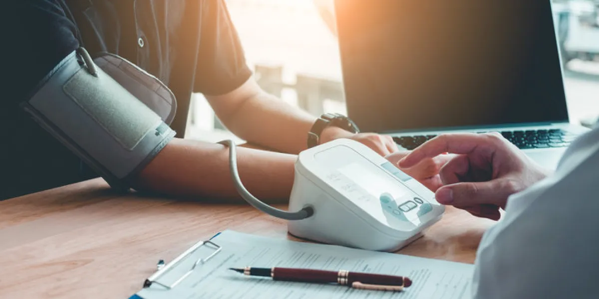 doctor measuring arterial blood pressure woman patient on right arm health care in hospital doctor measuring arterial blood pressure woman patient on right arm health care in hospital