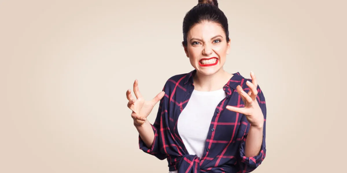 portrait of stressed and annoyed young casual styled caucasian woman with hair bun holding hands in mad furious gesture, screaming with ragea nd anger negative human emotions, facial expressions portrait of stressed and annoyed young casual styled caucasian woman with hair bun holding hands in mad furious gesture, screaming with ragea nd anger negative human emotions, facial expressions