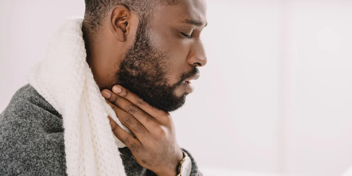 diseased african american man having sore throat diseased african american man having sore throat