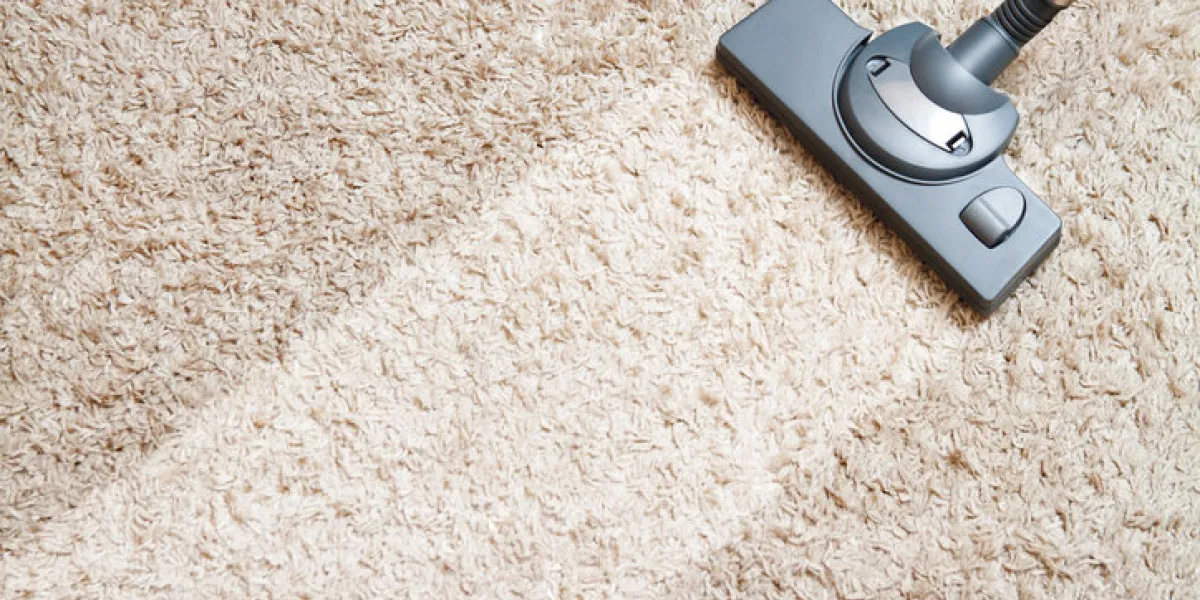 cleaning carpet by vacuum cleaner