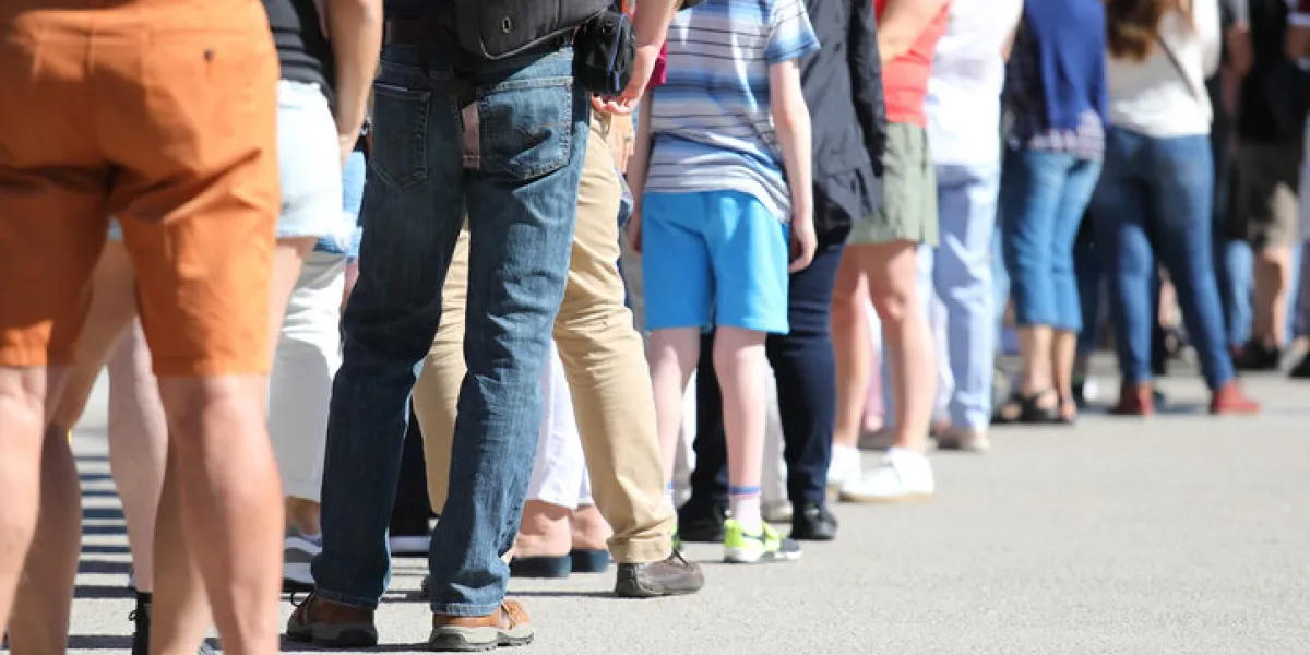 long queue of people waiting in line