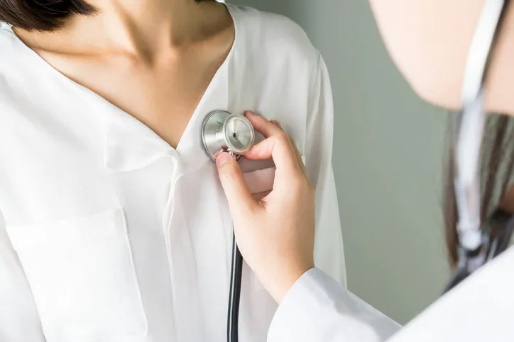 doctor is using a stethoscope for patients patient examination to hear the heart rate, for patients with heart disease