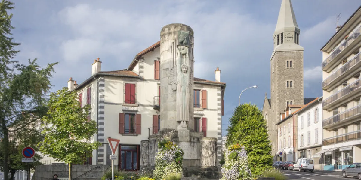 monument of paul doumer and the sacre coeur church in aurillac, france