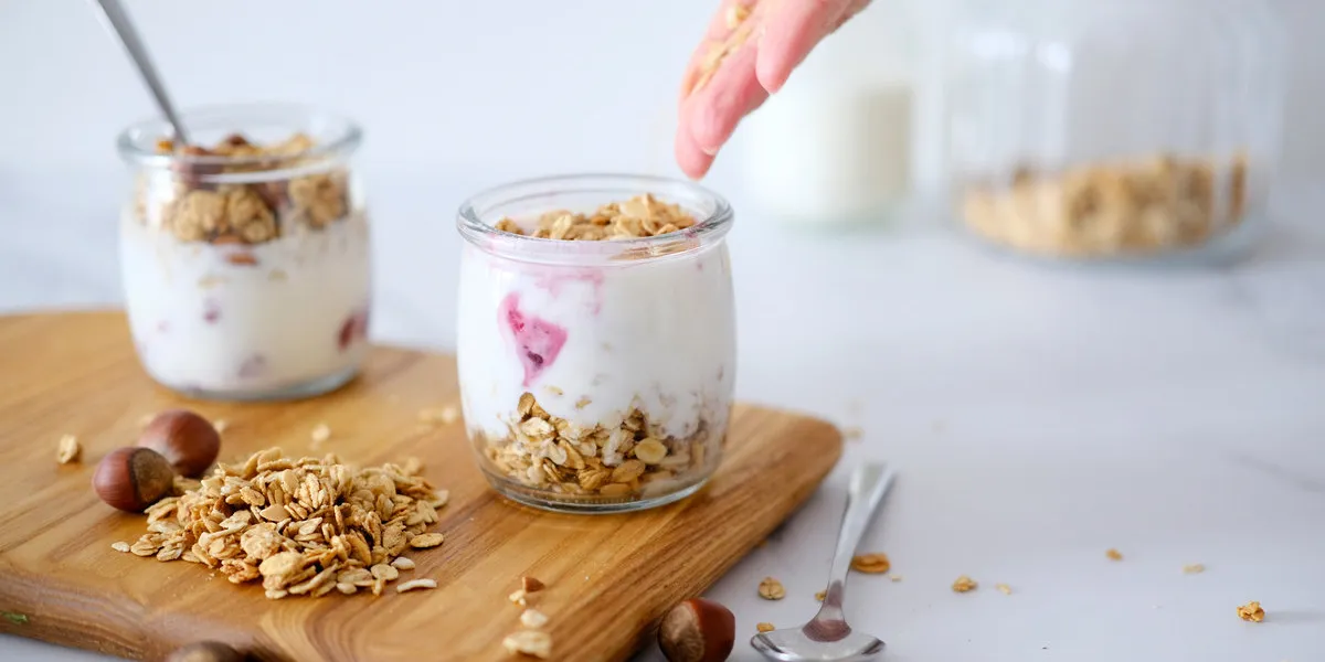 granola (oatmeal muesli) with yogurt in glass served weight loss diet concept detox menu tasty vegetarian breakfast, snack or dessert healthy eating concept morning table background granola (oatmeal muesli) with yogurt in glass served weight loss diet concept detox menu tasty vegetarian breakfast, snack or dessert healthy eating concept morning table background