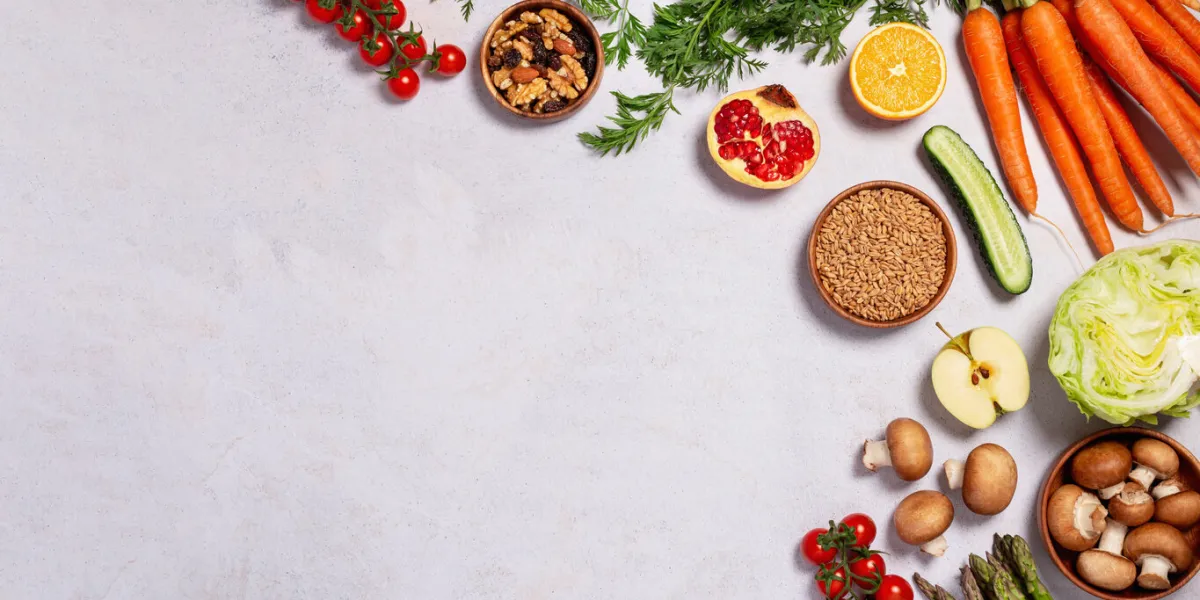 frame, border with raw fresh vegetables and fruits on table with text, veganuary concept, web banner, going vegan, eating green food background with vegan products, vegan food on table, top view