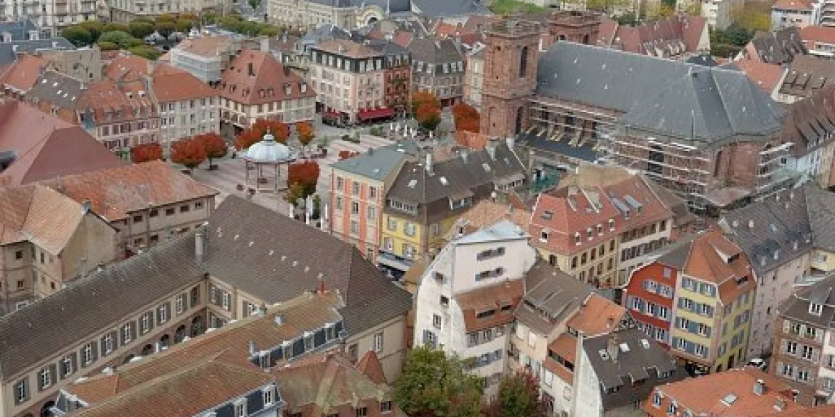 rooftops of the old city of belfort aerial view of the historic houses and buildings arranged densely to each other view from the citadel or fortress surrounding the city rooftops of the old city of belfort aerial view of the historic houses and buildings arranged densely to each other view from the citadel or fortress surrounding the city