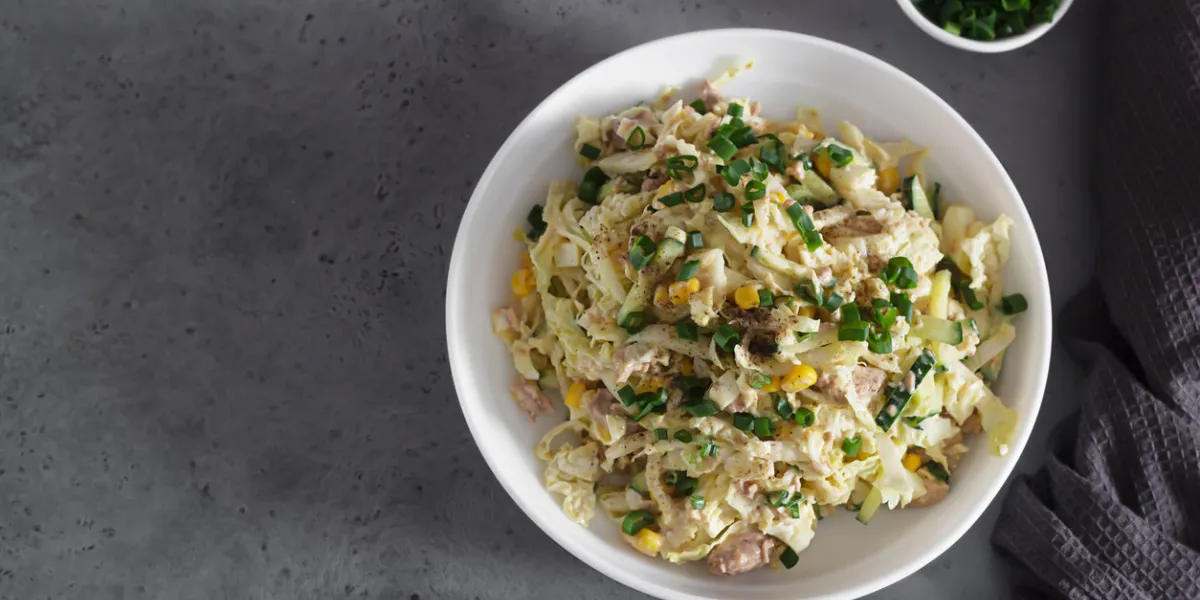 fresh vegetable salad with cabbage, canned cod liver, sweet corn, cucumber and quail eggs healthy balanced diet fresh vegetable salad with cabbage, canned cod liver, sweet corn, cucumber and quail eggs healthy balanced diet