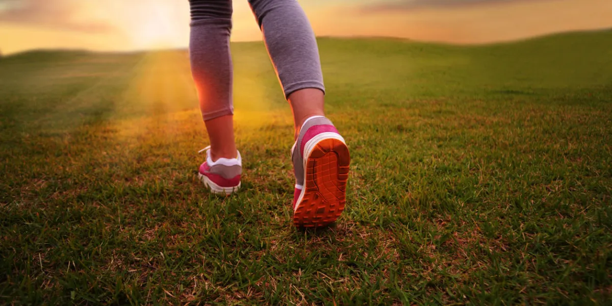rear view of girls running legs and feet in the sunny morning