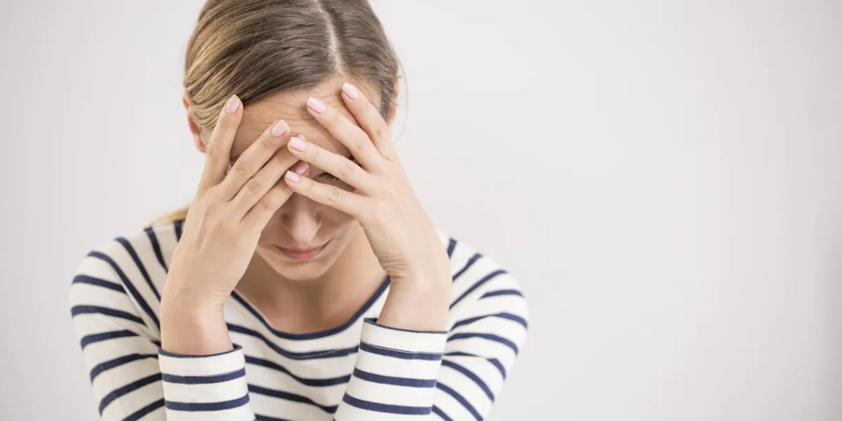young hopeless woman suffering from depression having nervous breakdown holding head on isolated background, copy space young hopeless woman suffering from depression having nervous breakdown holding head on isolated background, copy space