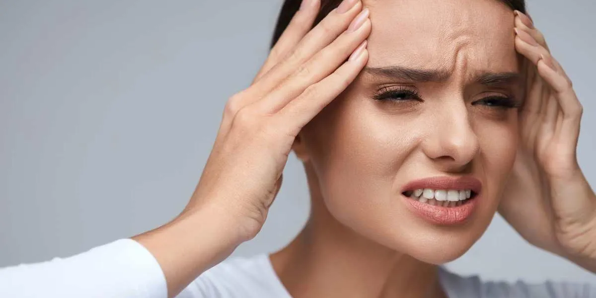 headache pain woman feeling terrible strong discomfort head ache beautiful female suffering from painful migraine exhausted girl having stress, holding hands near face health care high resolution