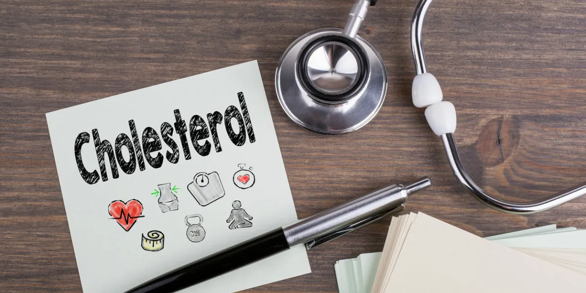 cholesterol, workplace of a doctor stethoscope on wooden desk background