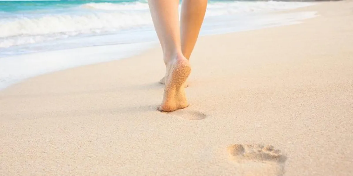 woman walking on the beach in hawaii woman walking on the beach in hawaii