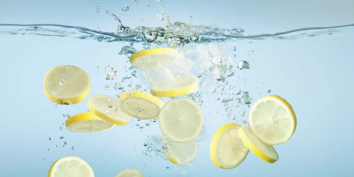 sliced lemons splashing in water sliced lemons splashing in water