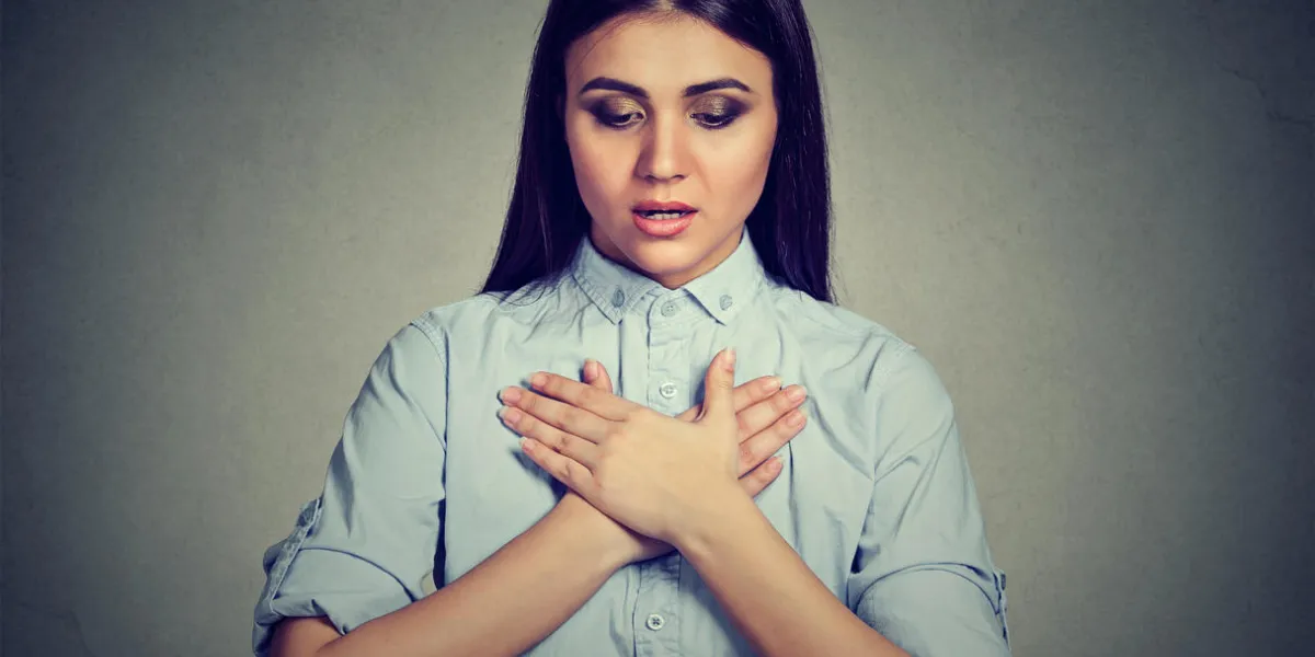 young woman with asthma attack or respiratory problem isolated on gray background young woman with asthma attack or respiratory problem isolated on gray background