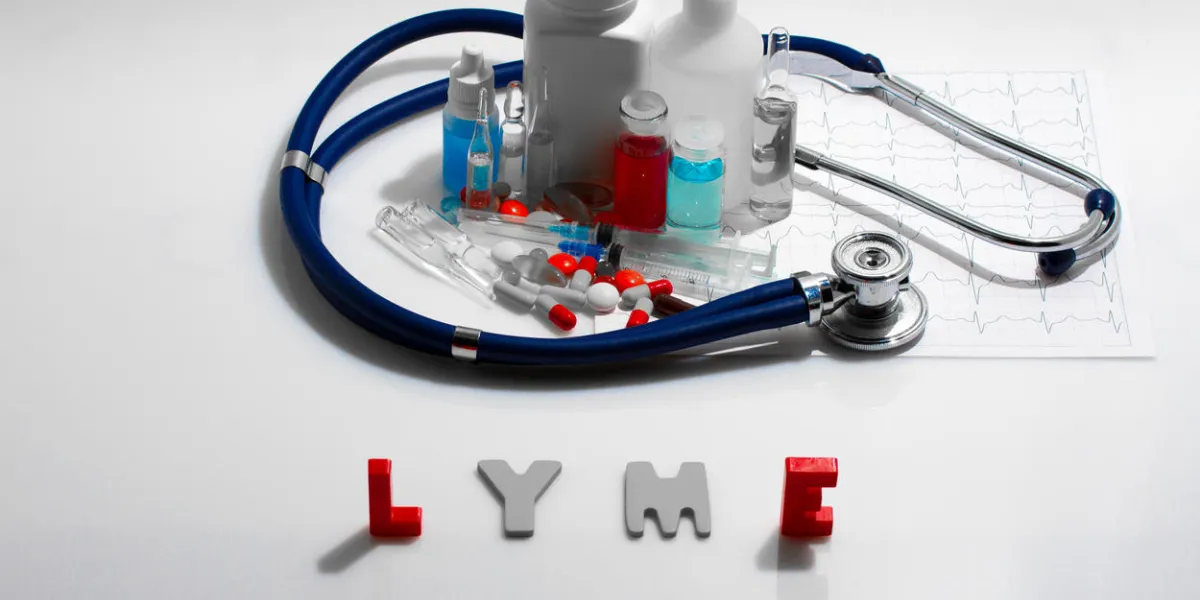 diagnosis - lyme medical concept with pills, injection, stethoscope, cardiogram and a syringe diagnosis - lyme medical concept with pills, injection, stethoscope, cardiogram and a syringe