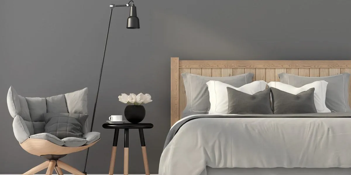 illustration 3d l'intérieur de la chambre grise avec une chaise en bois et un lit illustration 3d l'intérieur de la chambre grise avec une chaise en bois et un lit