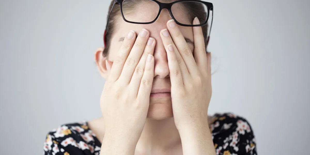 young woman with eye fatigue