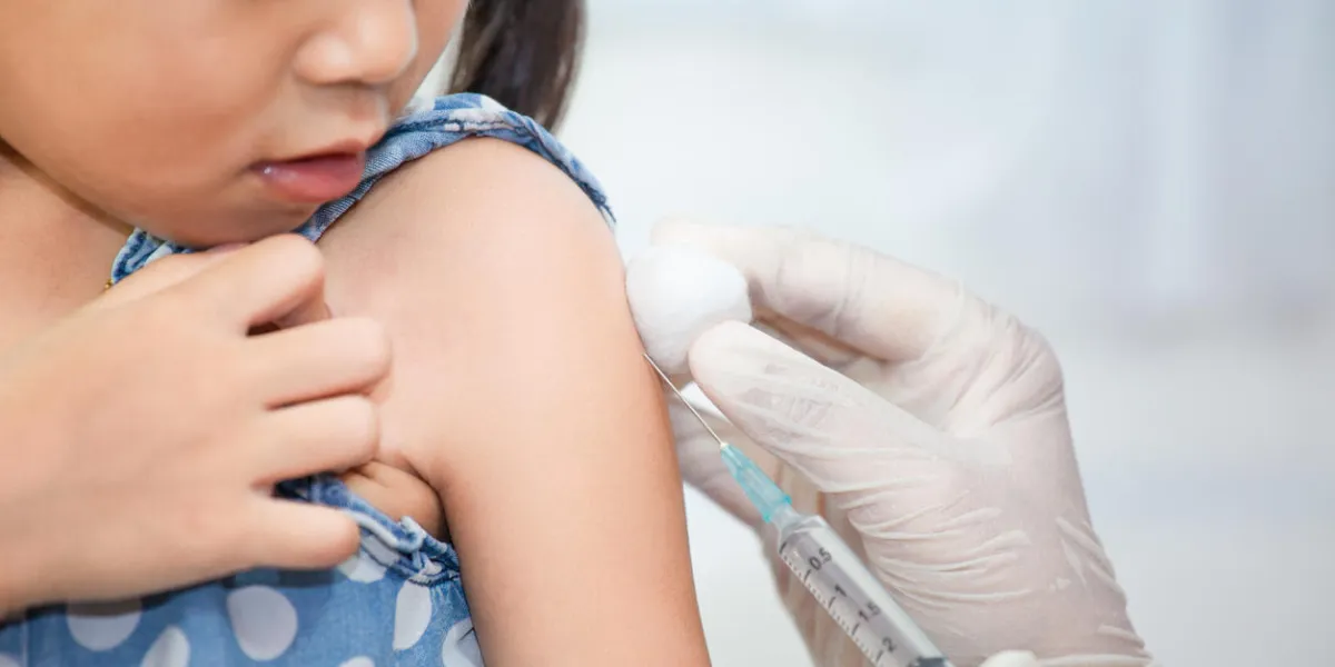 doctor injecting vaccination in arm of asian little child girl,healthy and medical concept doctor injecting vaccination in arm of asian little child girl,healthy and medical concept