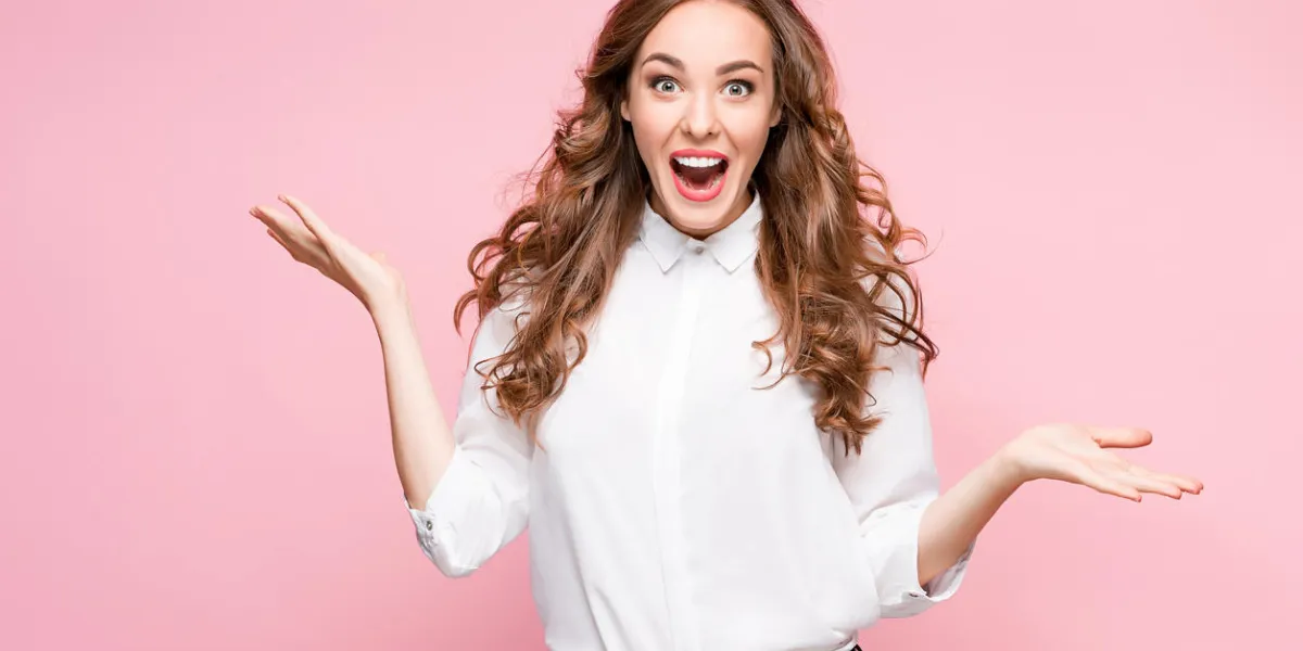 surprised happy beautiful woman looking in excitement studio shot on pink background surprised happy beautiful woman looking in excitement studio shot on pink background