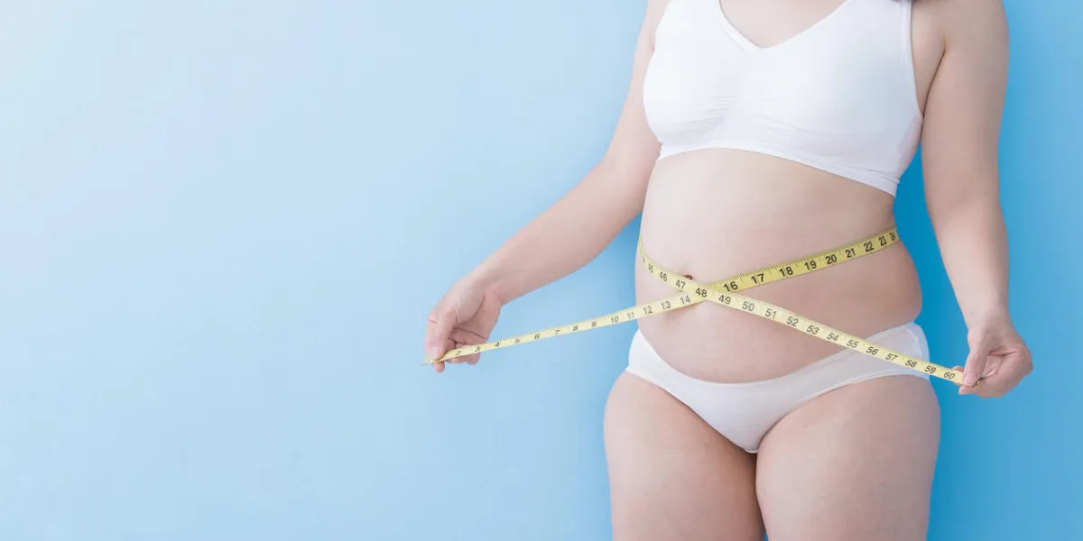 fat overweight woman take waist ruler amount with blue background, asian fat overweight woman take waist ruler amount with blue background, asian