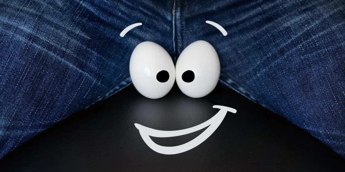 two large chicken eggs as a symbol of male testicle cheerful smiley face on the eggs