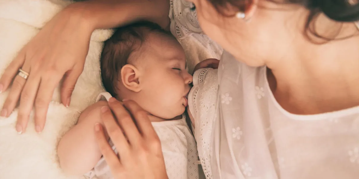beautiful young mom holding her 3 months baby mather nursing baby family at home beautiful young mom holding her 3 months baby mather nursing baby family at home