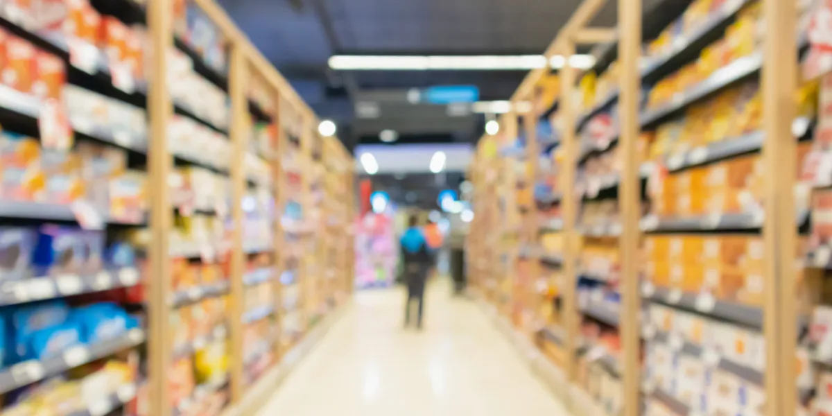 supermarket aisle with product shelves interior defocused blur background supermarket aisle with product shelves interior defocused blur background
