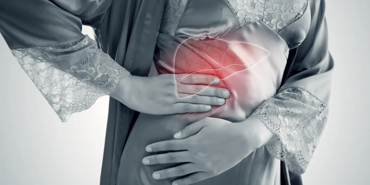 the photo of liver on woman's body against gray background, hepatitis, concept with healthcare and medicine